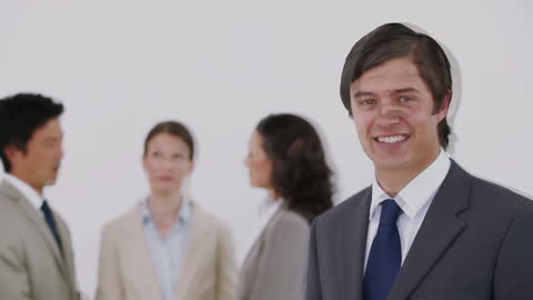 Cheerful Businessman in Team Environment