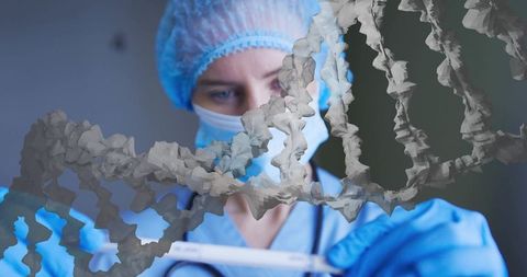 Clinician studying diagnostic sample in full ppe with dna double helix overlay