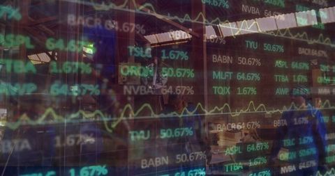 Industry and finance collide: worker inspects crates with stock tickers overlay