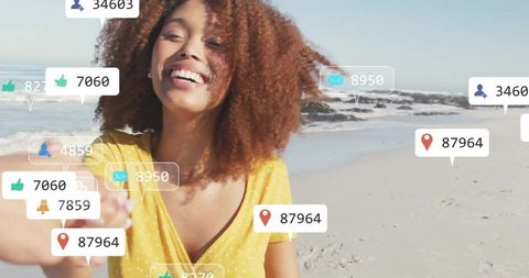 Young Influencer Engaged on Beach with Vibrant Social Media Elements