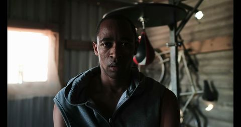 Determined Boxer Training in Underground Fitness Studio