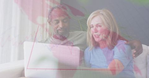 Senior Couple Reviewing Laptop in Comfortable Living Room Setting