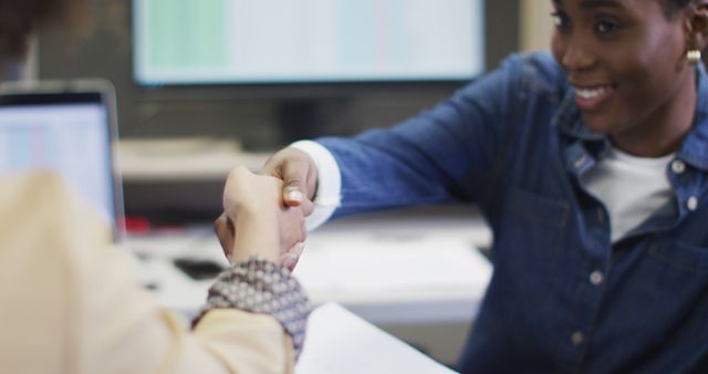 Business People Shaking Hands Over Desk in Office - Download Free Stock Photos Pikwizard.com