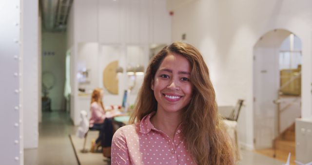 Young Professional Woman Smiling in Modern Office Setting - Download Free Stock Images Pikwizard.com