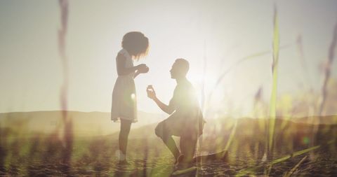 Silhouette Proposal on Sunny Beach at Sunset