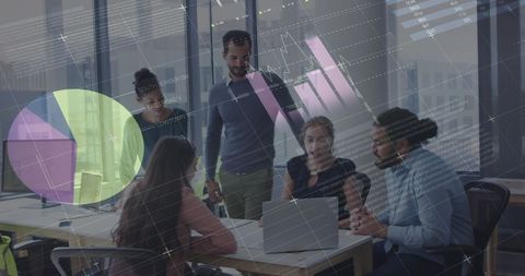 Young Professionals Discussing Digital Interface and Data Analysis