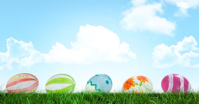 Vibrant Easter Eggs in Grass with Blue Sky Background - Download Free Stock Photos Pikwizard.com