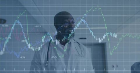 Doctor Analyzing Chart Data in Hospital Corridor