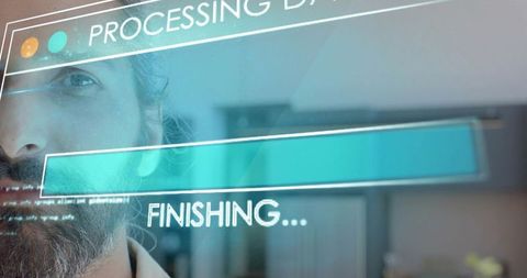 Bearded Indian Tech Professional Viewing Teal Holographic Progress Bar Finishing Data