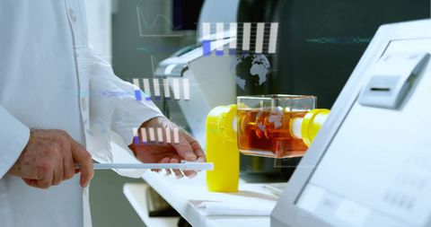 Scientist Engaging with Data and Laboratory Equipment for Research - Download Free Stock Images Pikwizard.com