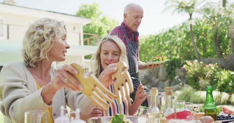 Family Enjoys Outdoor Barbecue Lunch Together - Download Free Stock Images Pikwizard.com