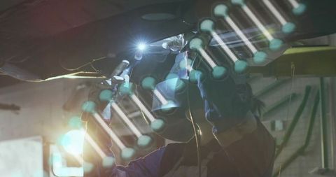 Female Mechanic Welding Under Car with DNA Technology Overlay in Industrial Garage