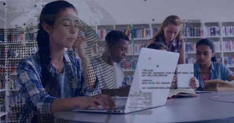 Students studying and collaborating with laptop and code overlay in library