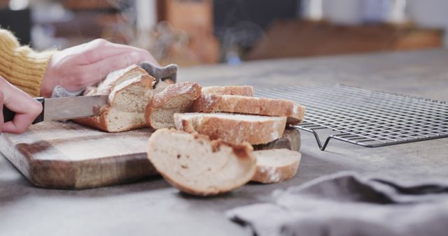 Close-up of Person Cutting Fresh Bread Loaf on Wooden Cutting Board - Download Free Stock Images Pikwizard.com