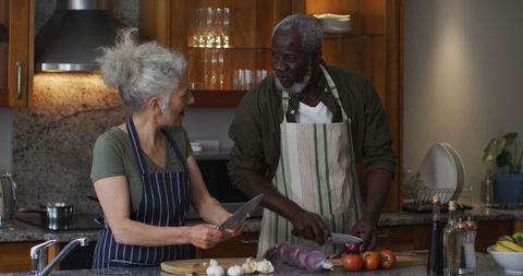 Seniors Enjoying Cooking Together in Cozy Kitchen