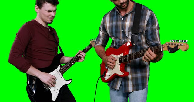 Male musicians playing guitar against green screen - Download Free Stock Photos Pikwizard.com