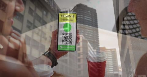Digital covid-19 vaccination passport concept in urban environment