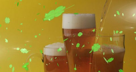 St. Patrick's Day Celebration with Beer and Falling Shamrocks - Download Free Stock Images Pikwizard.com