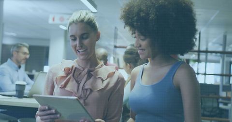 Diverse Businesswomen Collaborating on Digital Project in Modern Office - Download Free Stock Images Pikwizard.com