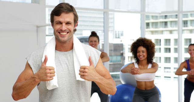 Cheerful Fitness Instructor Leading Group Exercise Class in Modern Gym - Download Free Stock Images Pikwizard.com