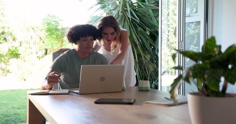 Young Couple Collaborating Remotely at Home