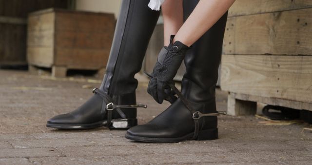 Equestrian Preparing Riding Boots Outdoors - Download Free Stock Images Pikwizard.com