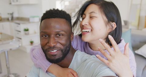Diverse Couple Celebrating Engagement in Living Room - Download Free Stock Images Pikwizard.com