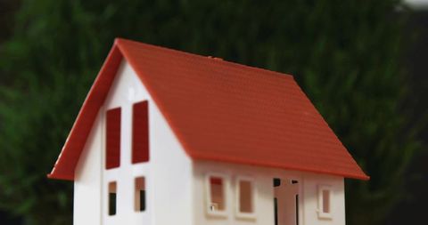 Miniature White Scale House Featuring Red Roof Closeup Macro with Bokeh Background