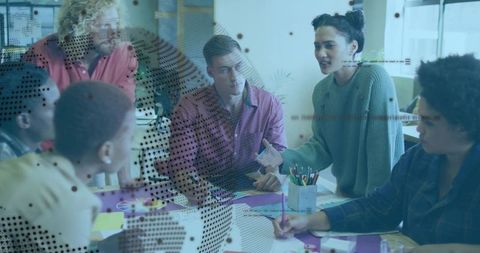 Professionals Collaborating Around Table in Modern Office
