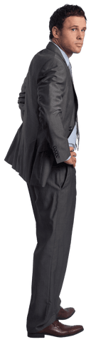 Confident businessman in transparent formal attire with hands on hips