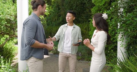 Guests Socializing and Smiling at Outdoor Wedding Reception