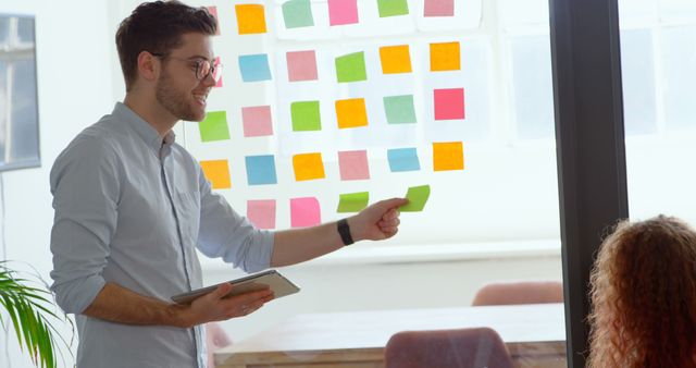 Young Businessman Leading Creative Meeting with Sticky Notes - Download Free Stock Images Pikwizard.com