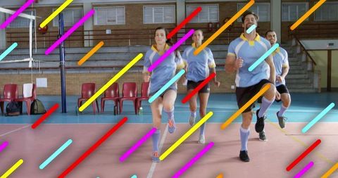 Group Athletes Performing High-Knee Warm-up in Sports Arena