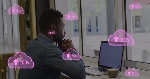 Businessman Analyzing Data with Digital Cloud Analytics Overlay