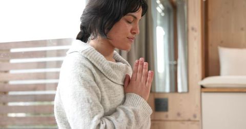 Woman Practicing Mindfulness in Serene Wooden Room