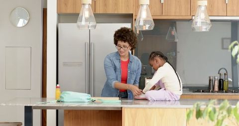 Mother and Daughter in Warm Family Kitchen Environment