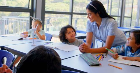 Diverse Schoolkids Engaging with Teacher in Classroom Setting - Download Free Stock Images Pikwizard.com