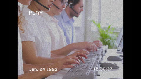 Retro Call Center Employees Working at Computers