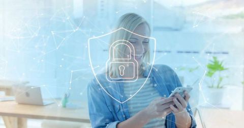 Professional Woman in Modern Workspace with Digital Security Shield