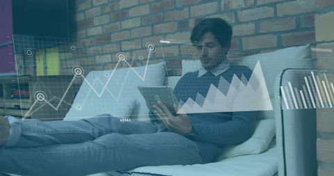 Caucasian Businessman Analyzing Digital Financial Charts at Office