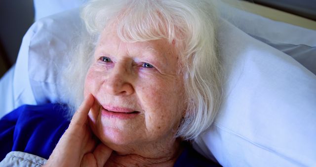 Happy Elderly Woman Lying in Hospital Bed - Download Free Stock Images Pikwizard.com