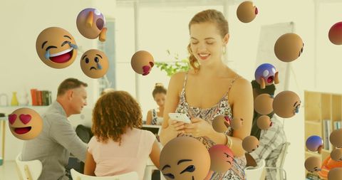 Smiling Woman Using Smartphone in Collaborative Office