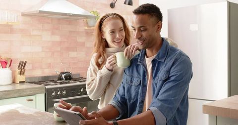Cozy Kitchen Couple Sharing Tablet for Breakfast