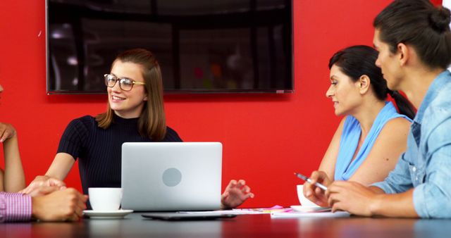 Business Team Collaborating in Modern Office with Red Wall - Download Free Stock Images Pikwizard.com