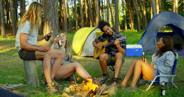 Group of Friends Enjoying Campsite with Guitar and Campfire - Download Free Stock Images Pikwizard.com