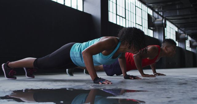 Athletic People Exercising with Push-Ups in Industrial Gym - Download Free Stock Images Pikwizard.com