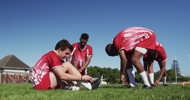 Soccer Players Tying Laces Outdoors Before Practice - Download Free Stock Images Pikwizard.com