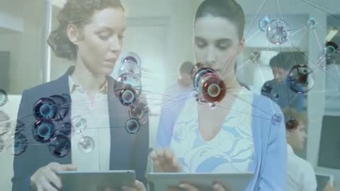 Women Collaborating on Tablets with Molecular Structure Animation