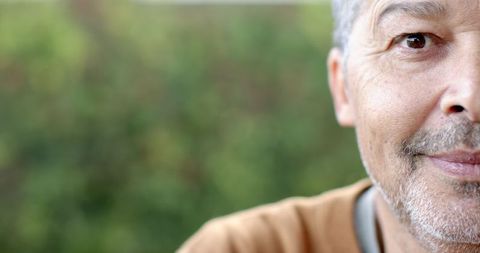 Serene Senior Man Outdoors Amidst Greenery