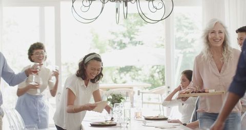 Family Gathering Around Dining Table Sharing Meal Together